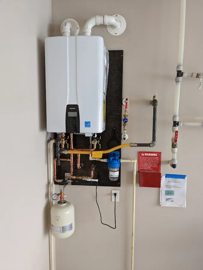 Professional plumber installing copper piping in a York home